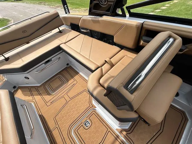 Slide: The Image of 2025 Cobalt R6 Surf boat interior with tan leather seating and modern design. - 27
