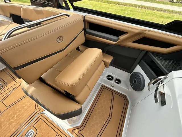 Slide: The Image of 2025 Cobalt R6 Surf boat interior with tan leather seating and modern design. - 28