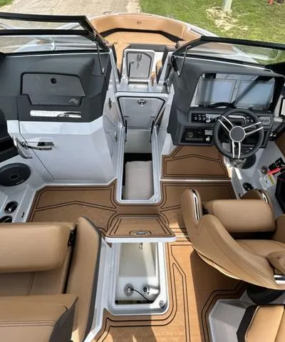 Slide: The Image of 2025 Cobalt R6 Surf boat interior with modern dashboard and luxurious seating. - 30