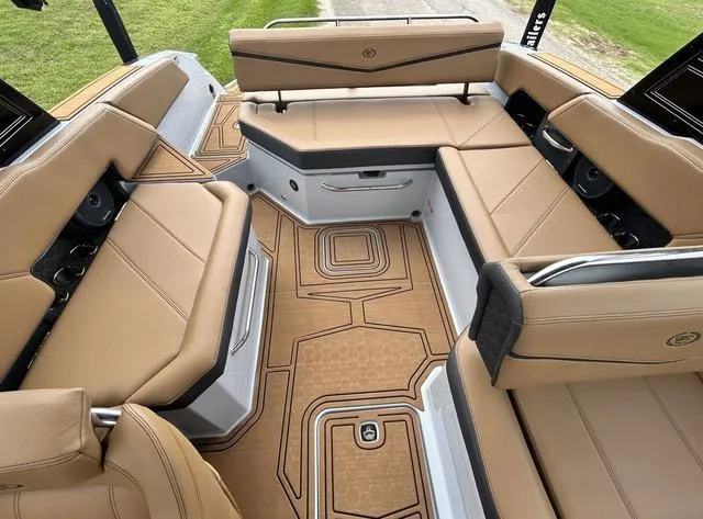 Slide: The Image of 2025 Cobalt R6 Surf boat interior with tan leather seating and modern design. - 32