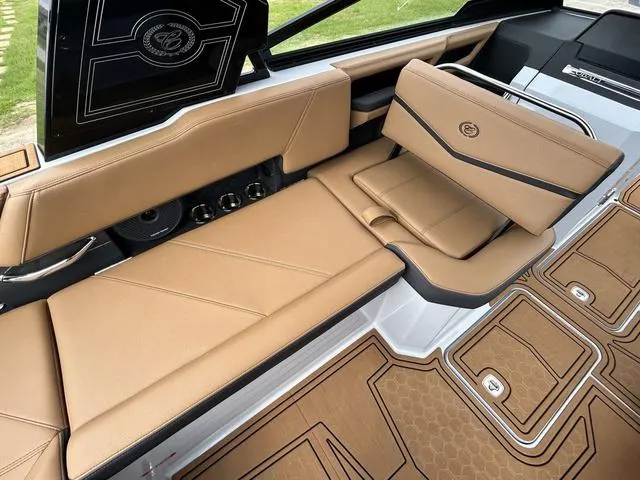 Slide: The Image of 2025 Cobalt R6 Surf boat interior with tan leather seating and modern design. - 33