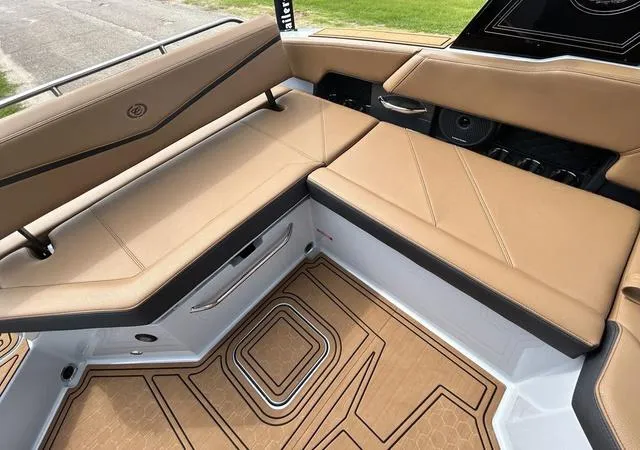 Slide: The Image of 2025 Cobalt R6 Surf boat interior with tan leather seating and stylish flooring. - 35