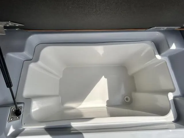 Slide: The Image of 2025 Cobalt R6 Surf boat storage compartment, open and empty. - 43