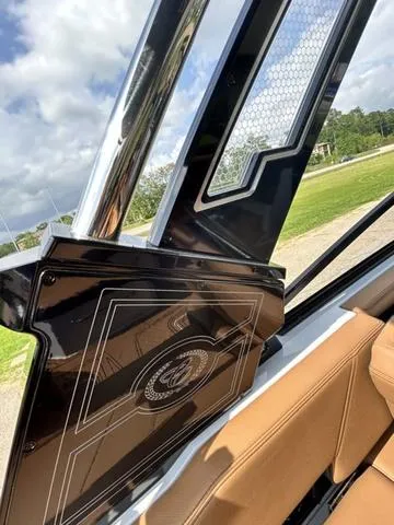 Slide: The Image of 2025 Cobalt R6 Surf interior with sleek design and luxurious tan seating. - 47