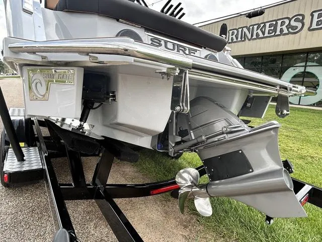 Slide: The Image of 2025 Cobalt R6 Surf boat rear view with propeller and surf gate. - 8