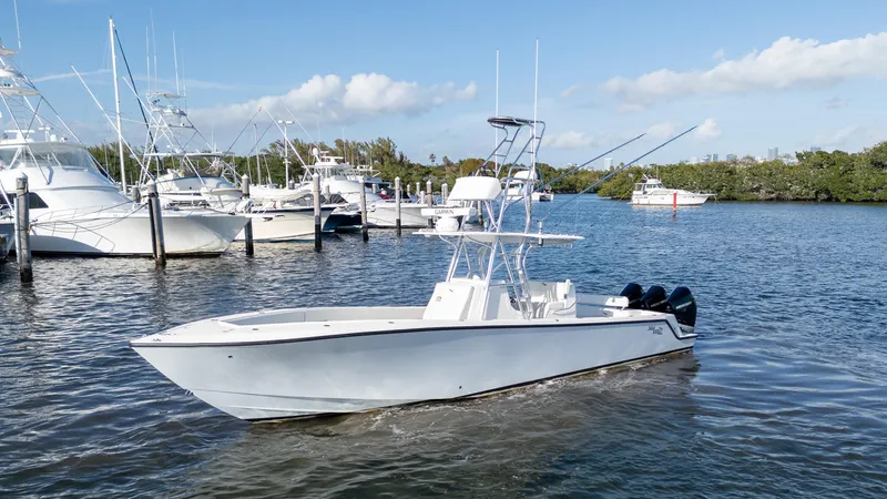 Slide: The Image of 2022 SeaVee 340Z boat in marina, clear sky, calm water. - 1