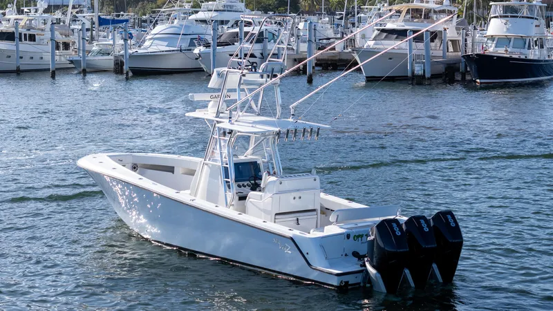 Slide: The Image of 2022 SeaVee 340Z boat with triple engines docked in a marina. - 3