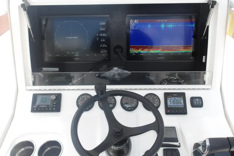 Slide: The Image of 2022 SeaVee 340Z dashboard with navigation screens and steering wheel. - 4