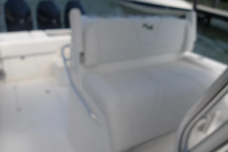 Slide: The Image of 2022 SeaVee 340Z boat interior with white seating and multiple outboard engines. - 6