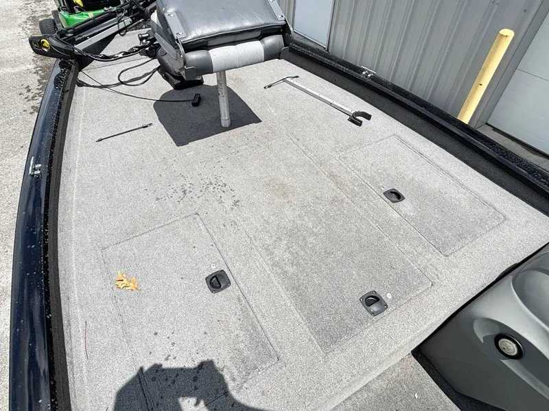 Slide: The Image of 2012 Bass Tracker PRO TEAM 190 boat deck with storage compartments and seat. - 5