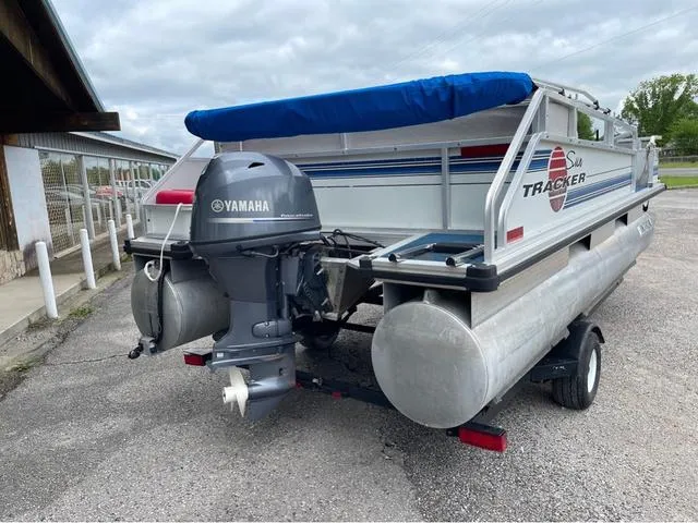 Slide: The Image of 1995 Sun Tracker BASS BUGGY 18 pontoon boat with Yamaha outboard motor on trailer. - 3