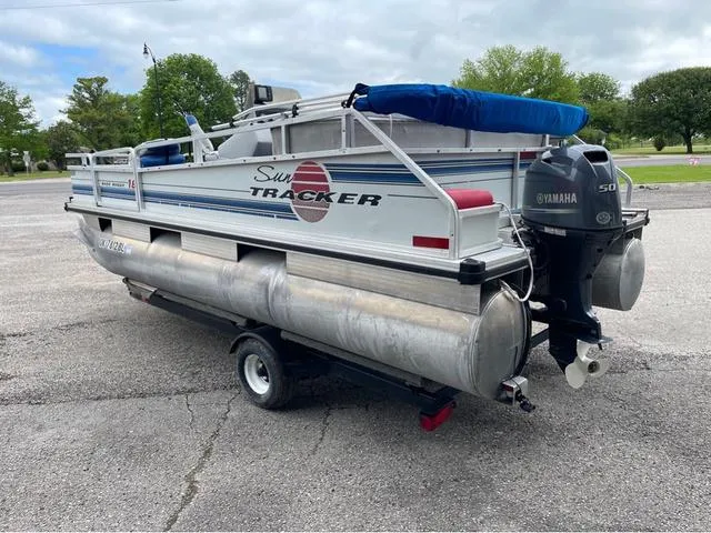 Slide: The Image of 1995 Sun Tracker BASS BUGGY 18 pontoon boat with Yamaha motor on trailer. - 4
