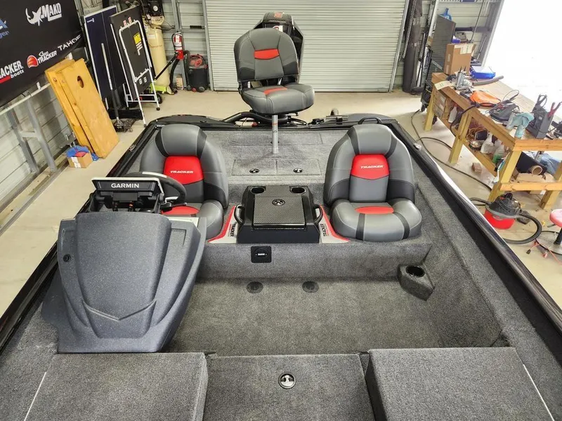 Slide: The Image of Interior of 2025 Tracker SAVAGE™ 215 boat with seating and Garmin equipment. - 11