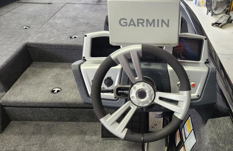Slide: The Image of Steering wheel and Garmin display on 2025 Tracker SAVAGE™ 215 boat. - 5
