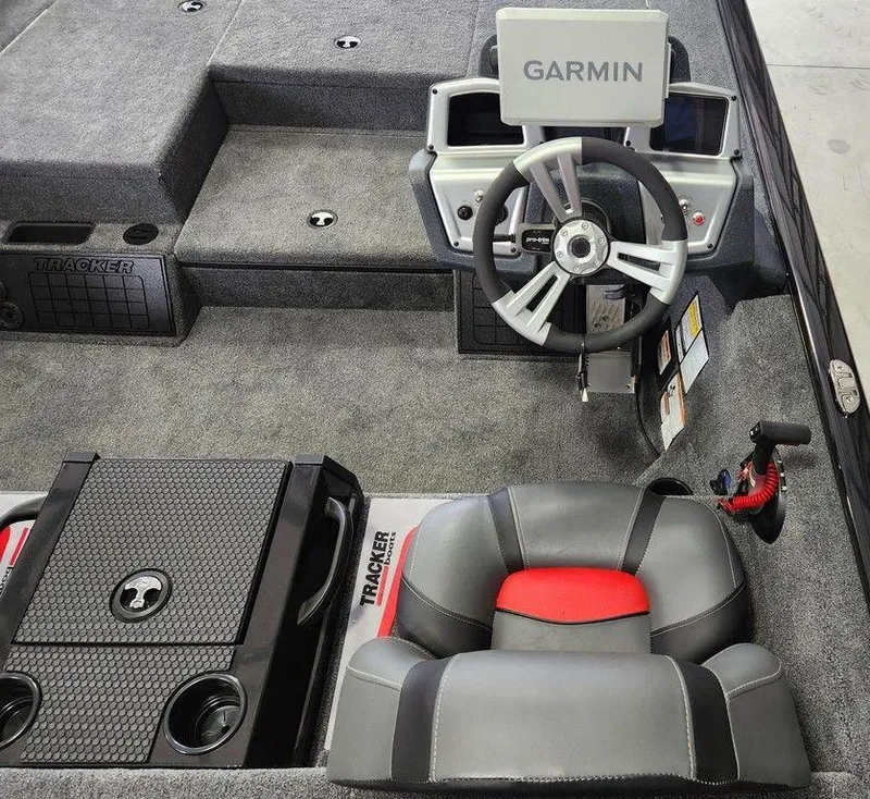 Slide: The Image of Interior of 2025 Tracker SAVAGE™ 215 boat with Garmin navigation system and comfortable seating. - 6