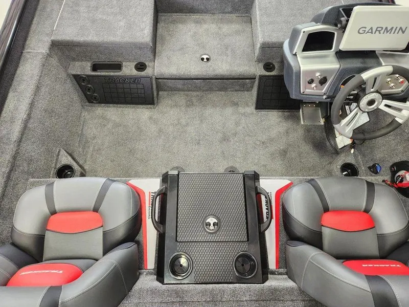 Slide: The Image of Interior of 2025 Tracker SAVAGE™ 215 boat with modern seating and Garmin dashboard. - 7