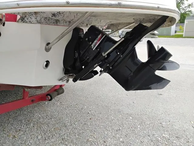Slide: The Image of 2004 Sylvan 2240 Deck Boat with Mercury outboard motor, rear view. - 6