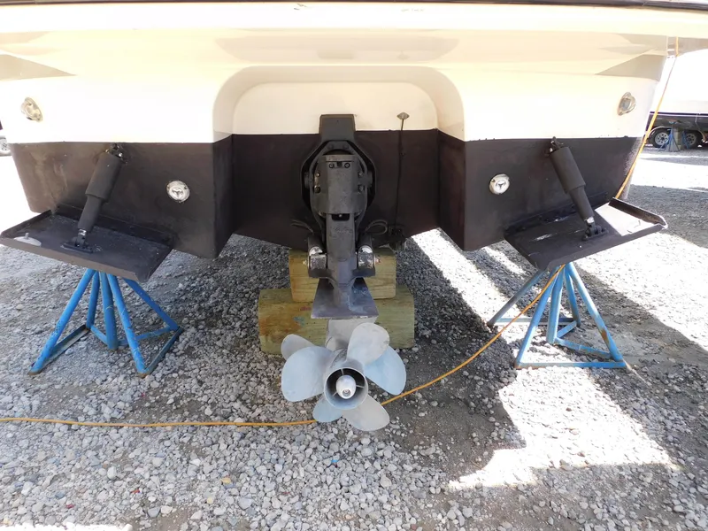 Slide: The Image of Rear view of 2011 Monterey 260 SCR boat on stands, showing propeller and hull. - 11