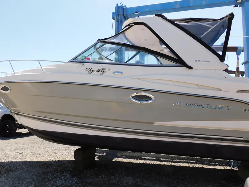 Slide: The Image of 2011 Monterey 260 SCR boat on display, side view with name "My Kitty II." - 2