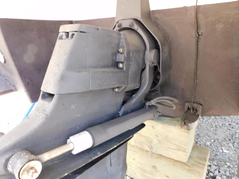 Slide: The Image of Close-up of 2011 Monterey 260 SCR boat's outdrive on wooden blocks. - 24