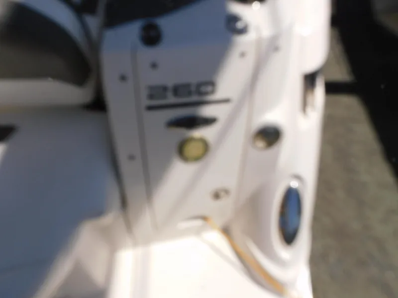Slide: The Image of Blurry view of a 2011 Monterey 260 SCR boat interior detail. - 26