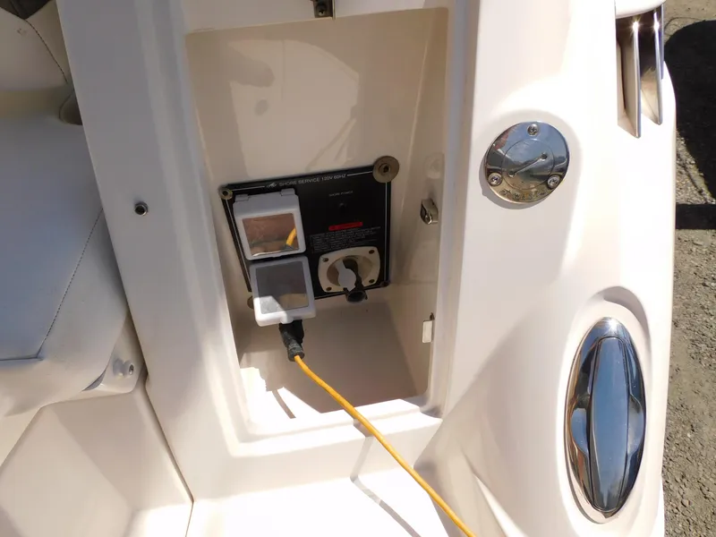 Slide: The Image of 2011 Monterey 260 SCR boat shore power connection with yellow cable. - 27