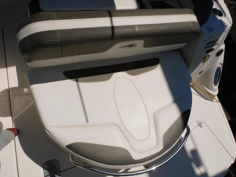 Slide: The Image of 2011 Monterey 260 SCR boat seating area with cushioned upholstery and sleek design. - 29