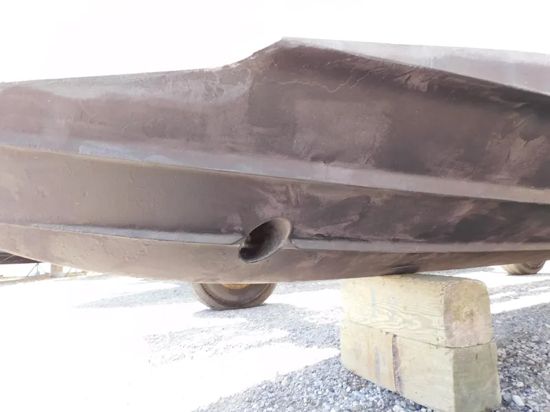 Slide: The Image of 2011 Monterey 260 SCR boat hull on wooden blocks, underside view. - 3