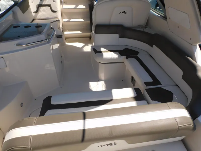 Slide: The Image of Interior of a 2011 Monterey 260 SCR boat with seating and steps. - 31