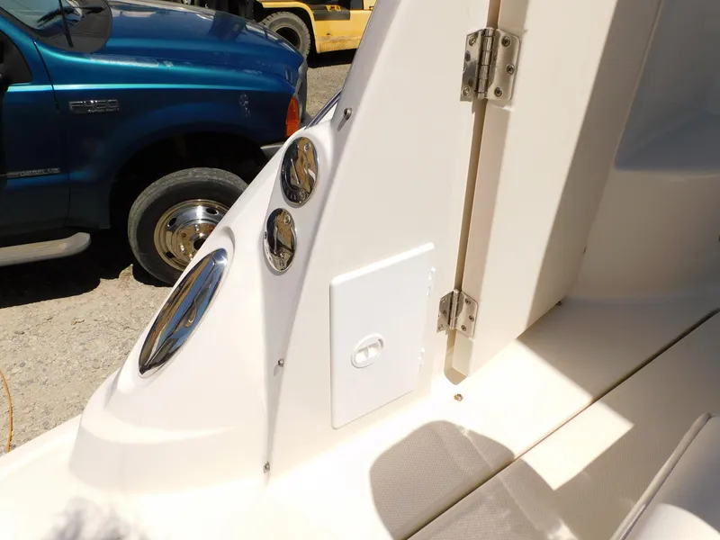 Slide: The Image of 2011 Monterey 260 SCR boat interior detail with chrome fixtures and white paneling. - 35