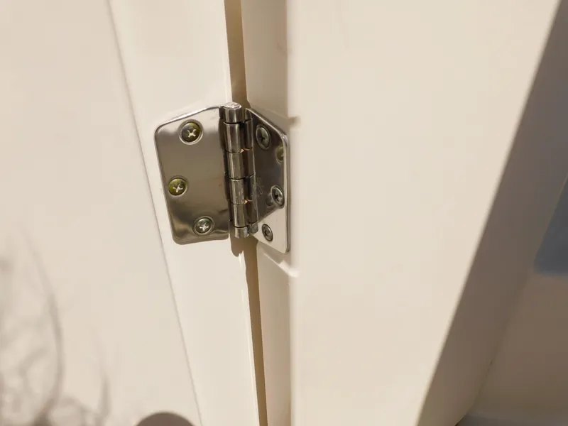 Slide: The Image of Stainless steel hinge on a 2011 Monterey 260 SCR boat door. - 37