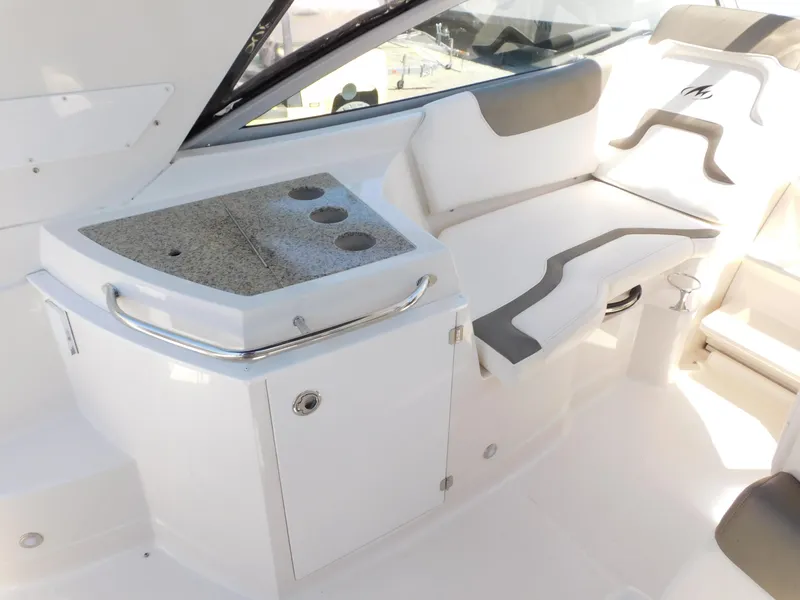 Slide: The Image of 2011 Monterey 260 SCR boat interior with seating and countertop. - 38