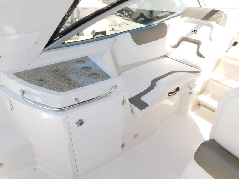Slide: The Image of 2011 Monterey 260 SCR boat interior with seating and countertop. - 39