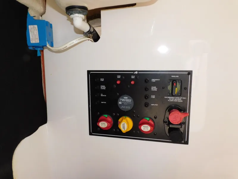 Slide: The Image of Control panel of a 2011 Monterey 260 SCR boat with switches and indicators. - 43