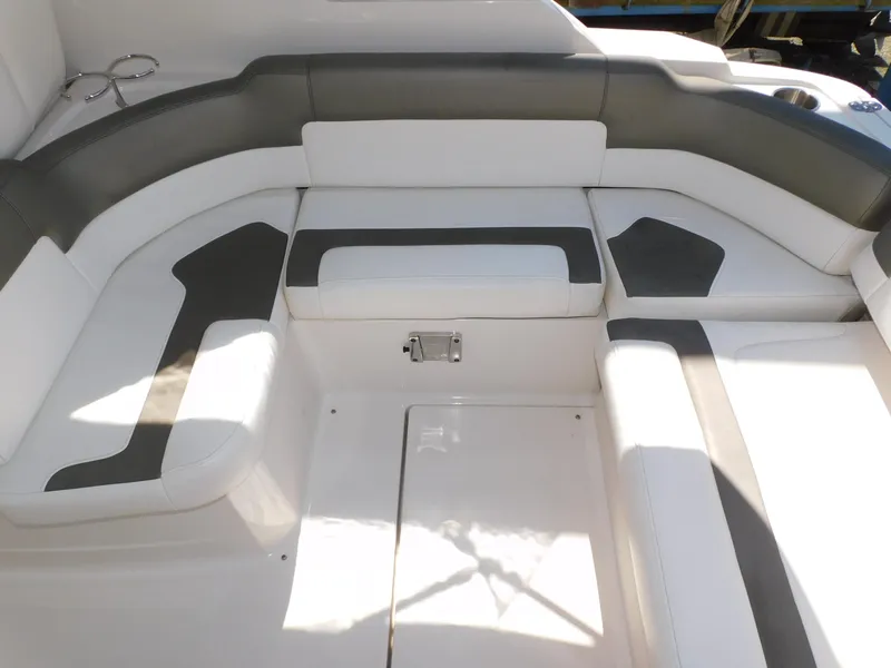Slide: The Image of 2011 Monterey 260 SCR boat interior with white and gray seating arrangement. - 46