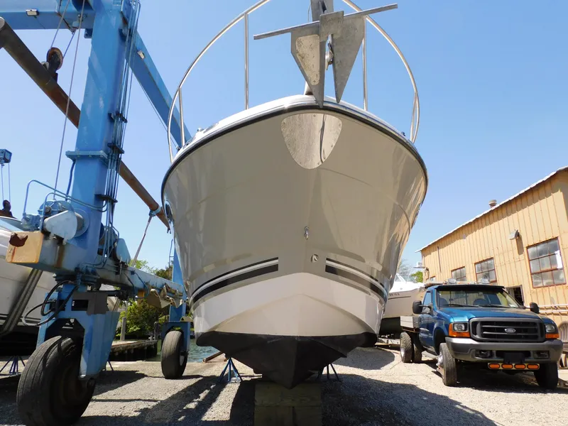 Slide: The Image of 2011 Monterey 260 SCR boat on dry dock beside a blue truck. - 5