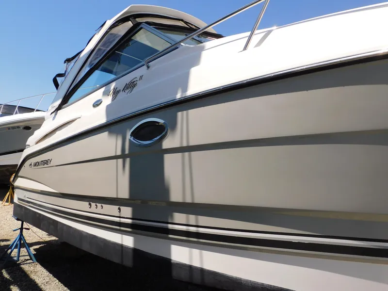 Slide: The Image of 2011 Monterey 260 SCR boat on stands, side view, sunny day. - 8