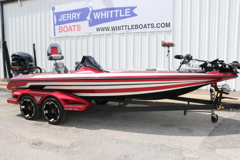 Slide: The Image of 2019 Skeeter FX20 bass boat in red, displayed at Jerry Whittle Boats dealership. - 12