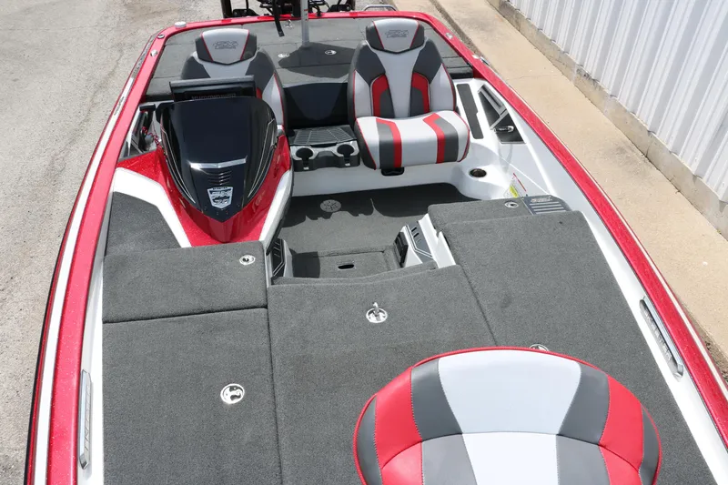 Slide: The Image of 2019 Skeeter FX20 boat interior with red and gray seating and spacious deck. - 14