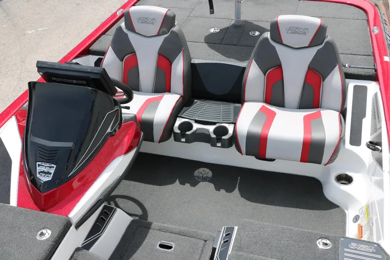 Slide: The Image of 2019 Skeeter FX20 boat interior with dual seats and console, featuring red and gray accents. - 16