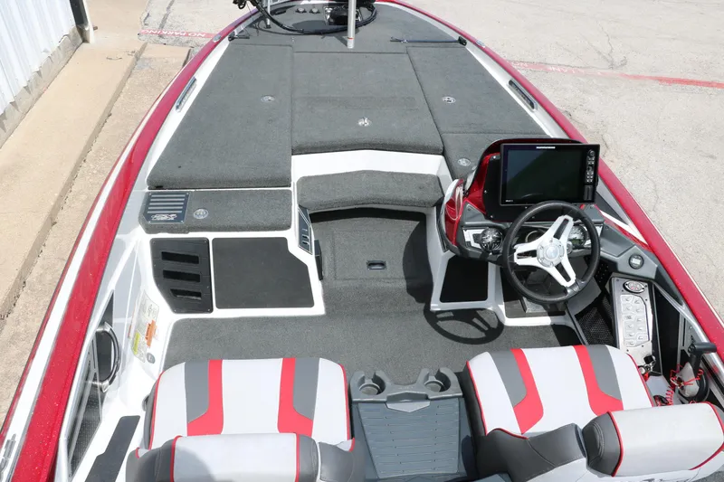 Slide: The Image of 2019 Skeeter FX20 boat interior with steering wheel, seats, and control panel. - 18