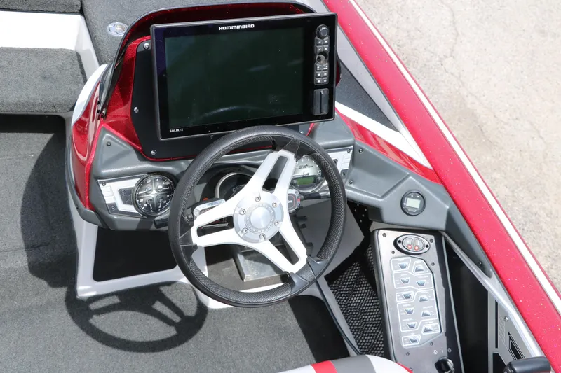 Slide: The Image of 2019 Skeeter FX20 boat dashboard with steering wheel and electronic display. - 22