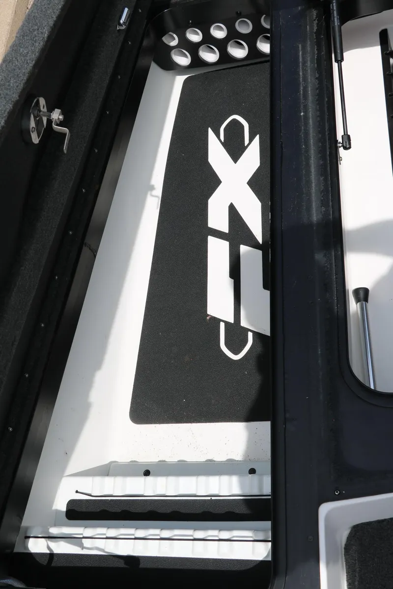 Slide: The Image of 2019 Skeeter FX20 boat interior with rod holders and FX logo. - 25