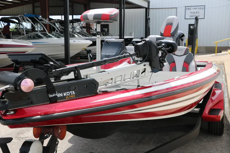 Slide: The Image of 2019 Skeeter FX20 bass boat with Minn Kota Ultrex trolling motor, parked in a marina. - 9