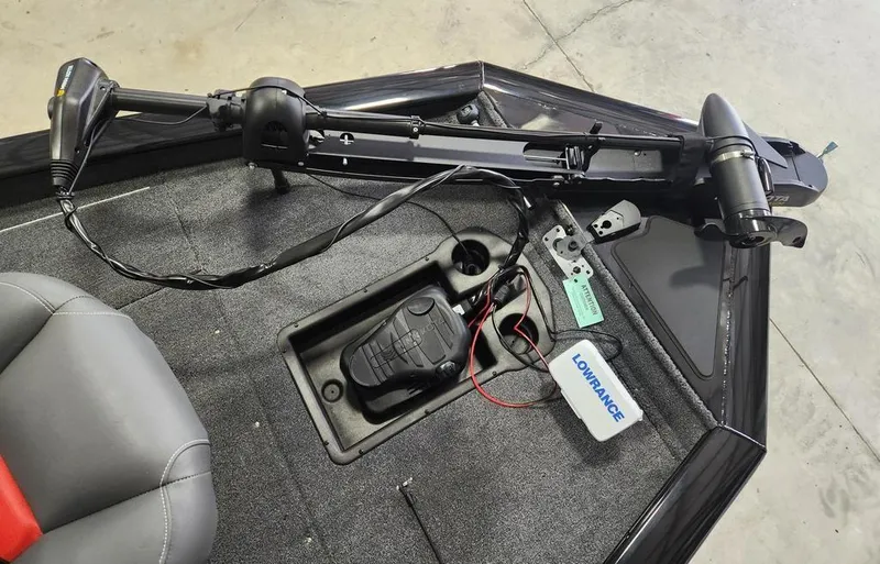 Slide: The Image of 2025 Tracker Pro Team™ 175 Tournament Edition boat deck with trolling motor and Lowrance device. - 11