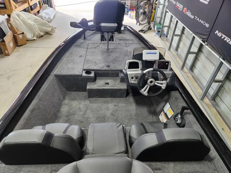 Slide: The Image of 2025 Tracker Pro Team™ 175 Tournament Edition boat interior with steering console and seating. - 6