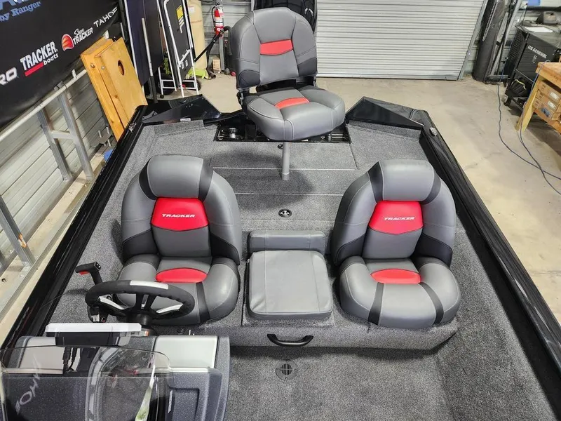 Slide: The Image of 2025 Tracker Pro Team™ 175 Tournament Edition boat interior with three gray and red seats. - 9