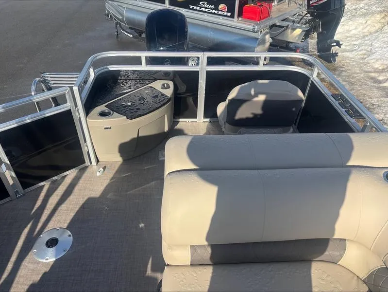 Slide: The Image of 2025 Sun Tracker SF 20 DLX pontoon boat interior with seating and console. - 3