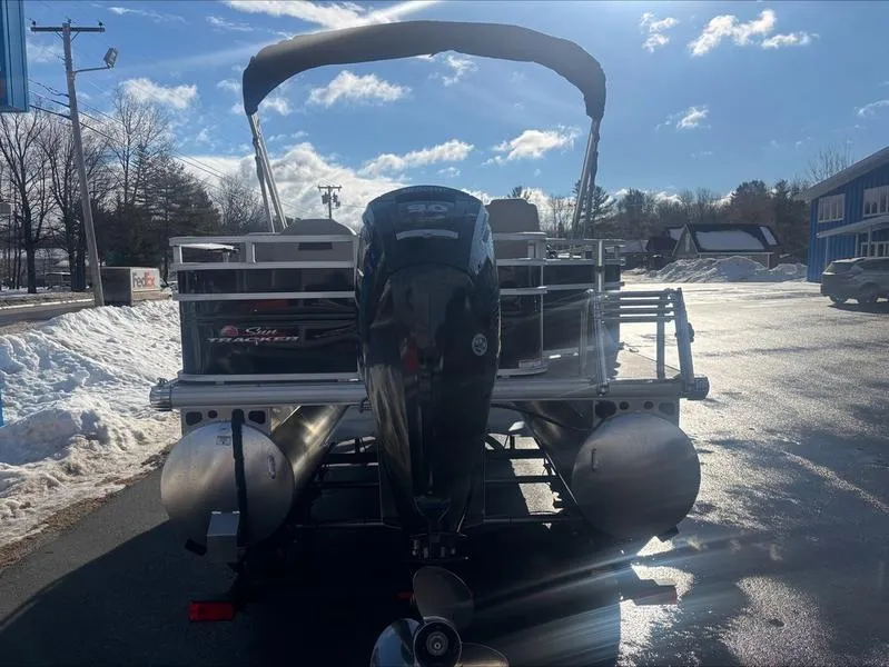 Slide: The Image of 2025 Sun Tracker SF 20 DLX pontoon boat with outboard motor in snowy parking lot. - 7