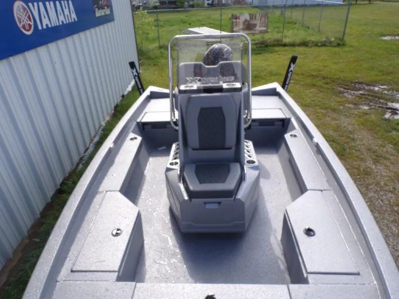 Slide: The Image of 2025 Xpress H20BAY boat with center console, gray interior, and Yamaha branding. - 10